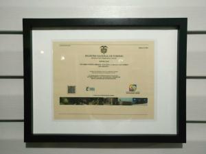 Um certificado, prêmio, placa ou outro documento exibido em Posada San Nicolas