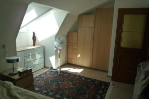 a bedroom with a window and a bed with a rug at Villa Bellevue Apartment 1 Deluxe Apartment in Ossiach