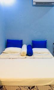 Postel nebo postele na pokoji v ubytování Mulia Homestay