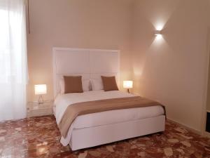 Letto o letti in una camera di B&B Via Cavour 32