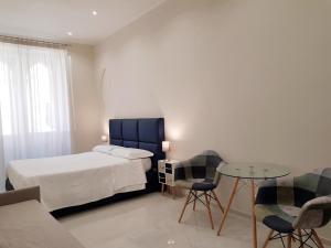 Letto o letti in una camera di B&B Via Cavour 32