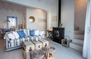 a living room with a couch and a table at Fonduco in Mahón