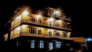 a building with lights on top of it at night at Hunza View Hotel in Hunza Valley