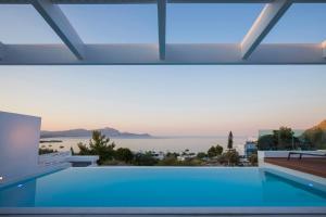 a swimming pool with a view of the water at Villa Serene with swimming pool in Lindos in Líndos