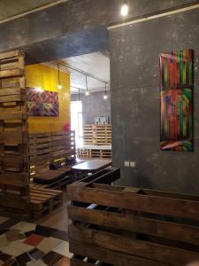 a dining room with wooden tables and a painting on the wall at Travel station in Ivano-Frankivsk