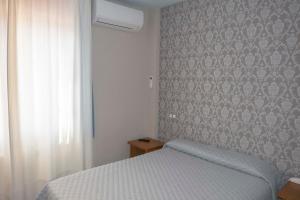 Postel nebo postele na pokoji v ubytování Hotel Simancas