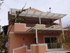 a house with a pergola on top of it at Corfu Villa Potamaki in Corfu Town