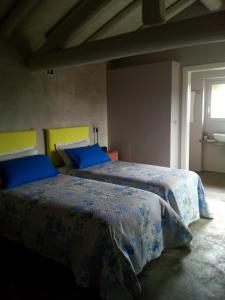 Postel nebo postele na pokoji v ubytování Casa Torre Allera