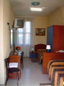 TV a/nebo společenská místnost v ubytování Hotel Greco
