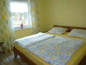 Ένα ή περισσότερα κρεβάτια σε δωμάτιο στο Haus Am Friedrichsbach