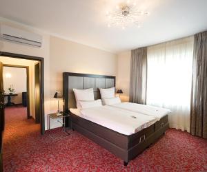 Postel nebo postele na pokoji v ubytování Top Hotel Krämer
