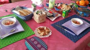 a table with food and bowls of food on it at SA SPENDULA B&B in Villacidro