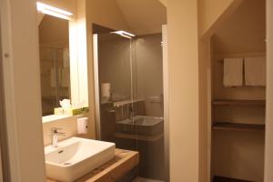 Ett badrum på Hotel Braun