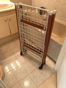 a shopping cart in a bathroom next to a tub at French Riviera Deluxe near Nice airport in Cagnes-sur-Mer