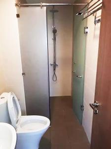 a bathroom with a toilet and a shower stall at SHP Plaza 12 Lach Tray Hai Phong in Hai Phong