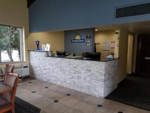 a lobby of a restaurant with a reception counter at Days Inn by Wyndham Oak Ridge Knoxville in Oak Ridge