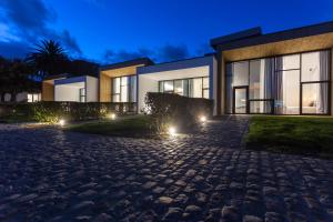 a house with lights in front of it at Quinta de Santa Clara in Ponta Delgada