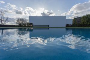 a large white screen sitting on top of a body of water at Quinta de Santa Clara in Ponta Delgada