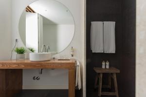 a bathroom with a sink and a mirror at Quinta de Santa Clara in Ponta Delgada