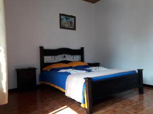 Postel nebo postele na pokoji v ubytování Hotel La Uvita