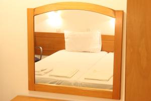Postel nebo postele na pokoji v ubytování Dimitra Hotel