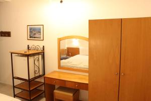 Postel nebo postele na pokoji v ubytování Dimitra Hotel