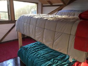 Postel nebo postele na pokoji v ubytování Hostal Climb House