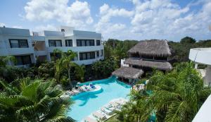 an aerial view of a resort with a swimming pool at Mak Nuk Village - Clothing Optional in Tulum