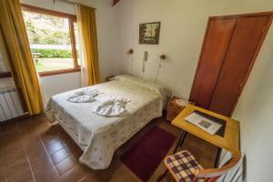 Ένα ή περισσότερα κρεβάτια σε δωμάτιο στο Posada Aymara +54 φωτογραφίες