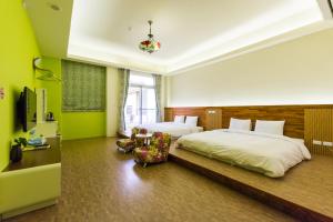 Giường trong phòng chung tại GJia Taitung B&B