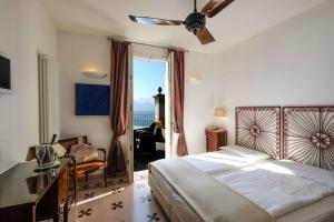 Кровать или кровати в номере Albergo Milano