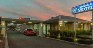 a car parked in front of a motel at Hamilton Lonsdale Motel in Hamilton