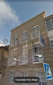 a building with a sign on the front of it at Pensión Vista Alegre in Vigo