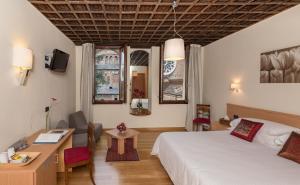 Postel nebo postele na pokoji v ubytování Hotel Casa Del Pellegrino
