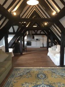 a living room with a couch and a rug at Bishop Percys House in Bridgnorth