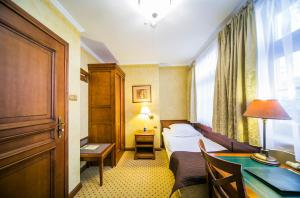 Postel nebo postele na pokoji v ubytování Hotel Opera