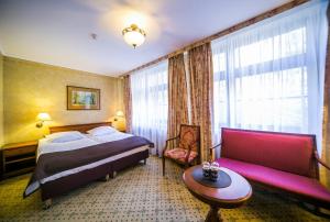 Postel nebo postele na pokoji v ubytování Hotel Opera