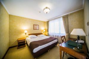 Postel nebo postele na pokoji v ubytování Hotel Opera