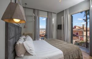 Postel nebo postele na pokoji v ubytování Leto Nuevo Hotel