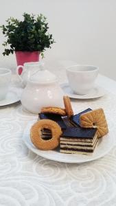 a plate of cookies and biscuits on a table at Apartman Marja - Studio in Njivice