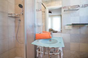 a bathroom with a sink and a shower at Haus Quentin in Willingen