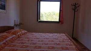 Postel nebo postele na pokoji v ubytování Apartmani Ruk
