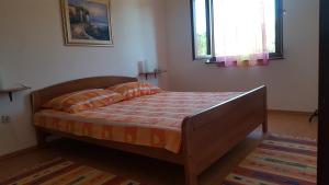 Postel nebo postele na pokoji v ubytování Apartmani Ruk