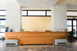 an office with a reception desk in a building at Albergo Ristorante Saverino in Valderice