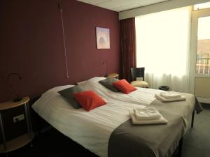 Letto o letti in una camera di Hotel Orion