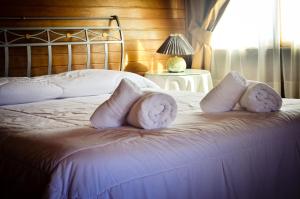 Postel nebo postele na pokoji v ubytování Hotel Termal Dayman