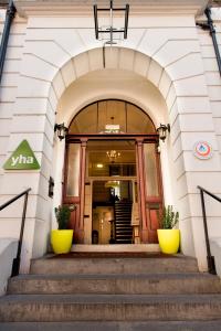 a doorway leading to a room with a large window at YHA London Earl's Court in London