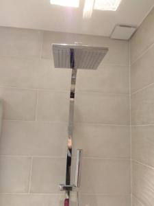 a shower in a bathroom with a ceiling at Mercière Jacobins in Lyon