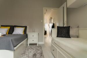 Postel nebo postele na pokoji v ubytování Apartament Na Urlop - Wisła Kamienna - Apartamenty z widokiem na panoramę Wisły