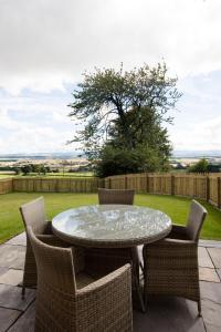 a table and chairs on a patio at Blairmore Farm in Crieff